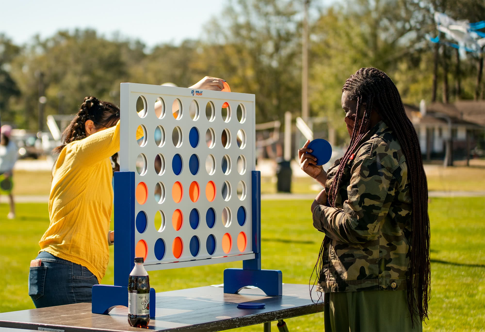 Girl plays connect four at PCC's Bible Conference Picnic