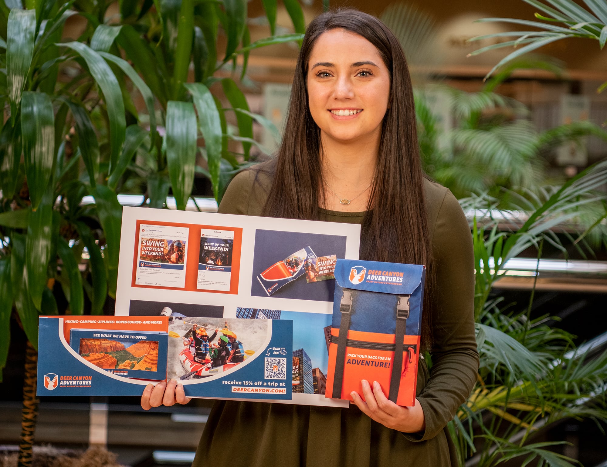 Tiffany Fredericks poses with her campaign designs.