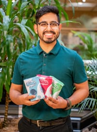 Ivan Montero poses with his package designs.