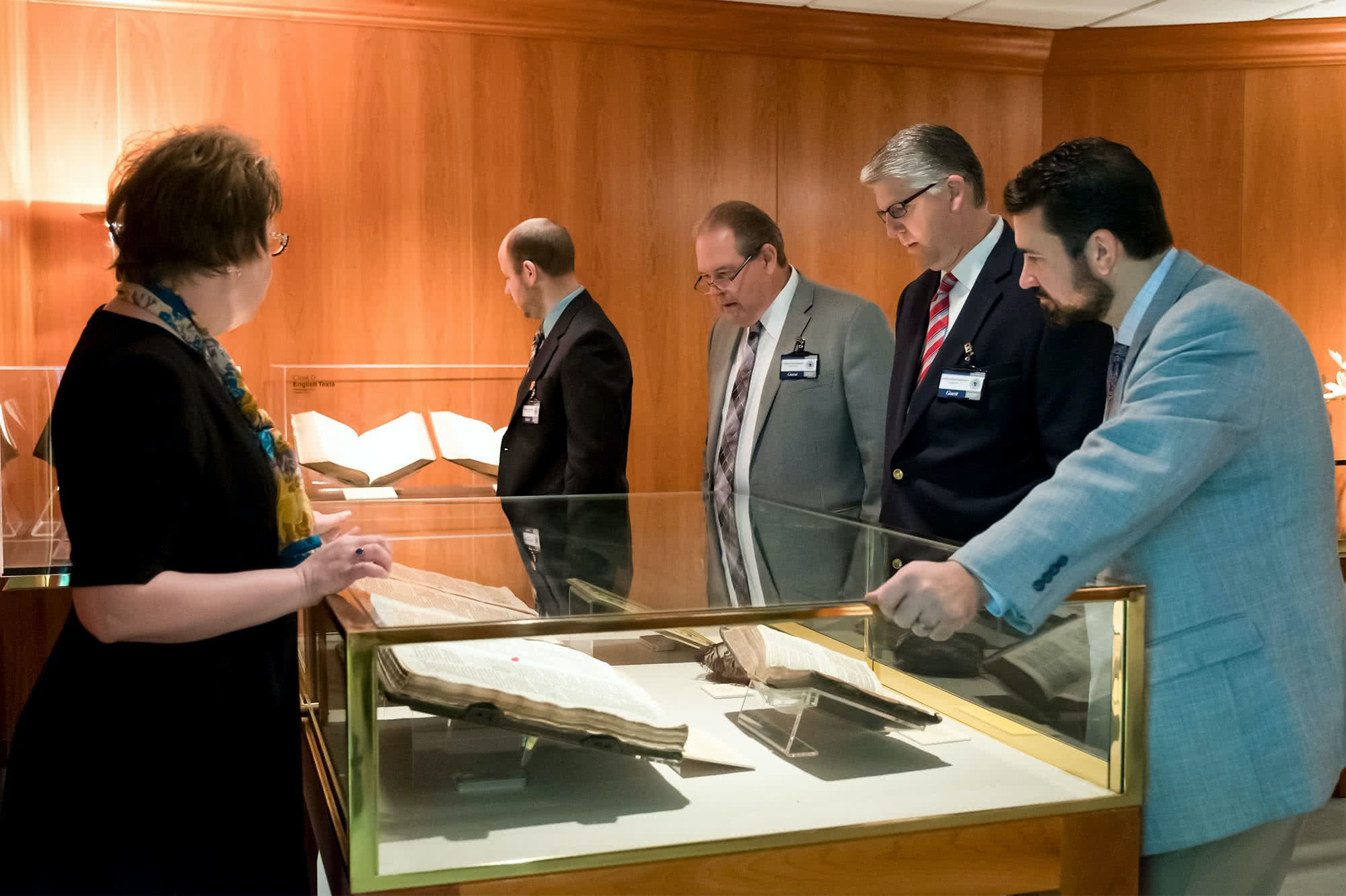 Group of people viewing artifacts
