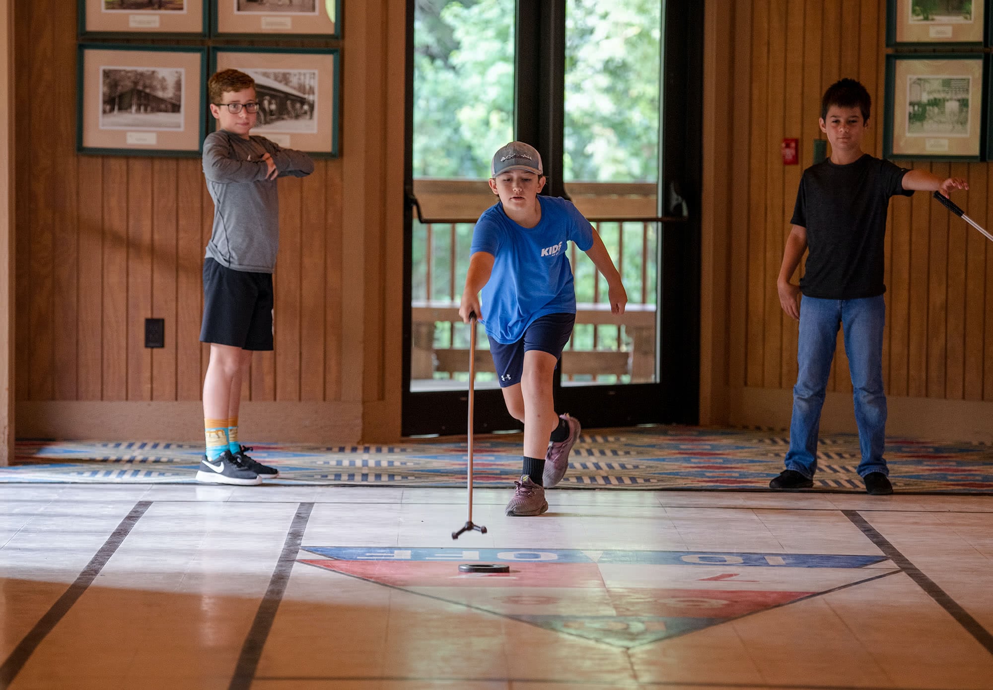 Camp O the Pines campers playing shuffleboard. 