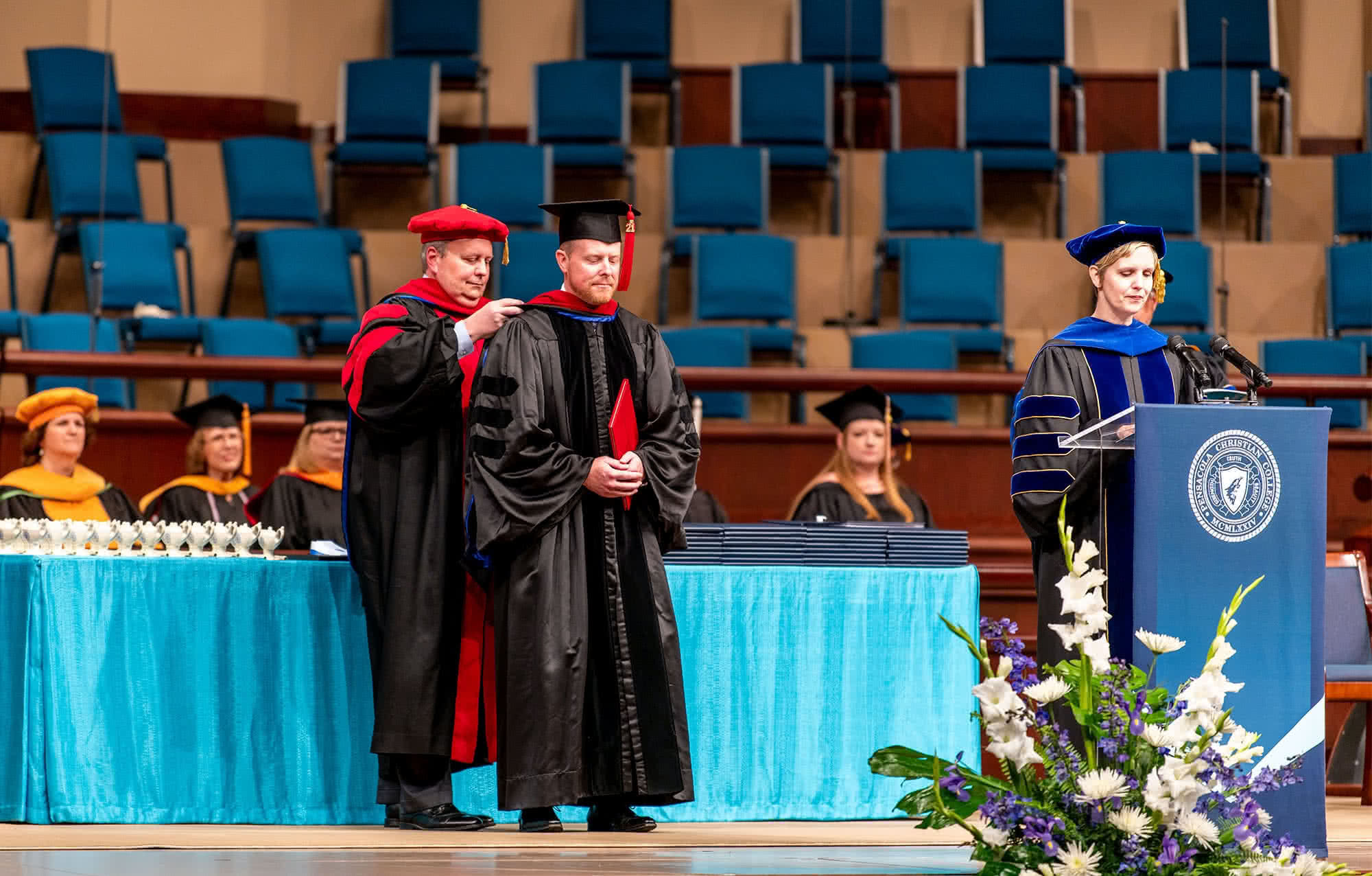 Male graduate on PCC's Crowne Centre stage