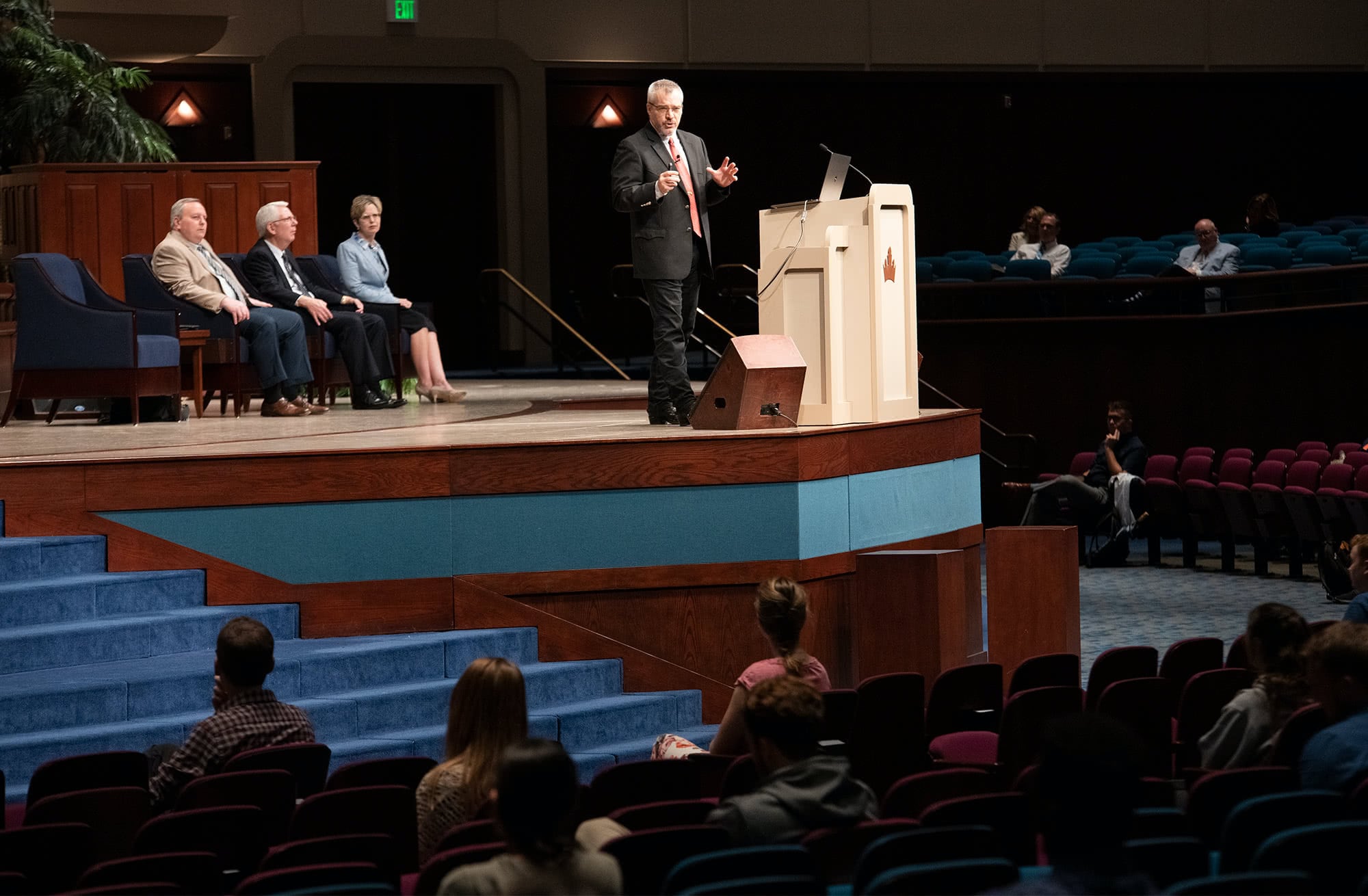Dr. Rick Green speaking to students during chapel on the Crowne Centre stage. 
