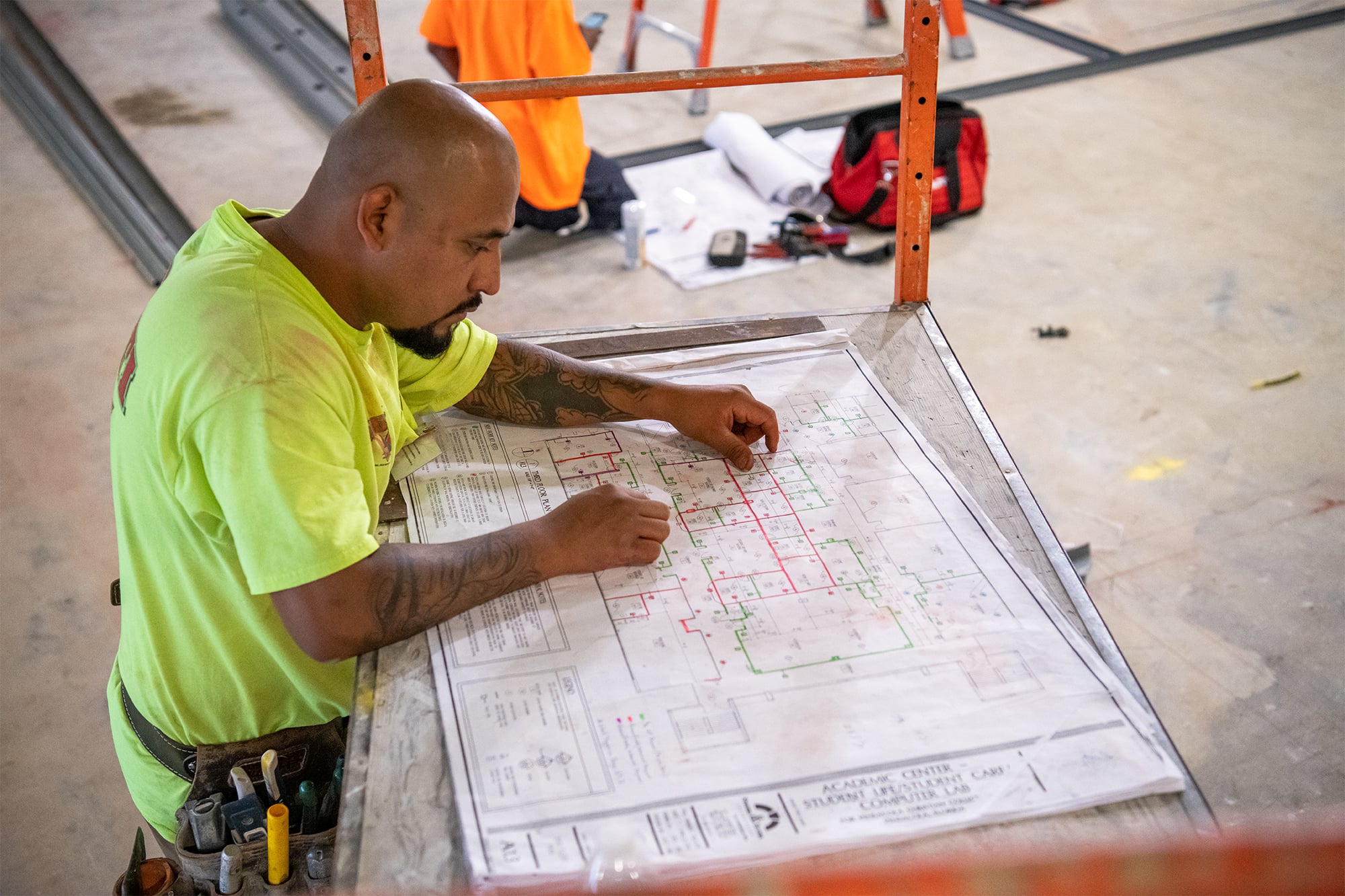 Construction worker looking at a blueprint.