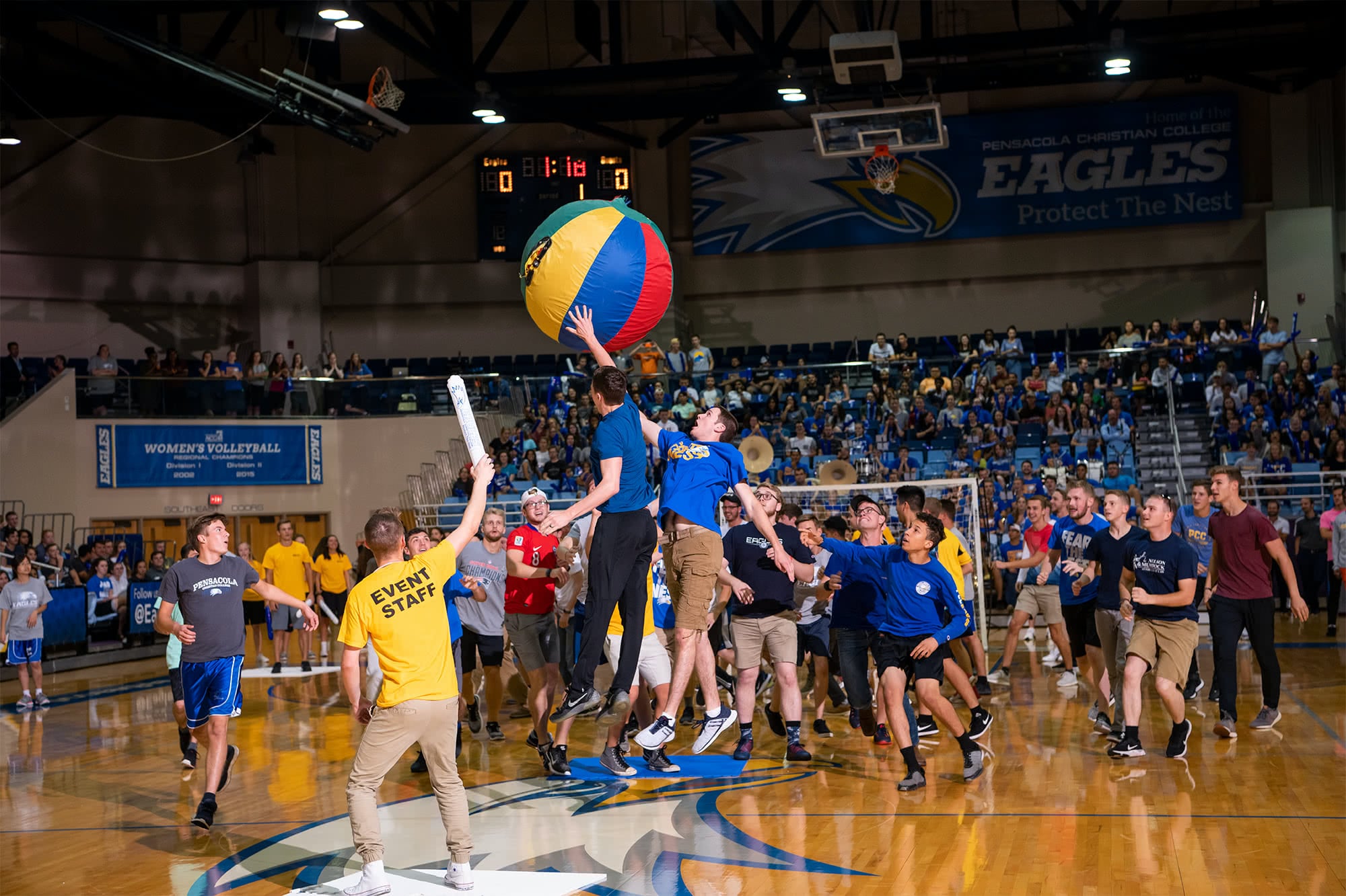 Volunteers from the student body play big ball volleyball at Eagle Mania.