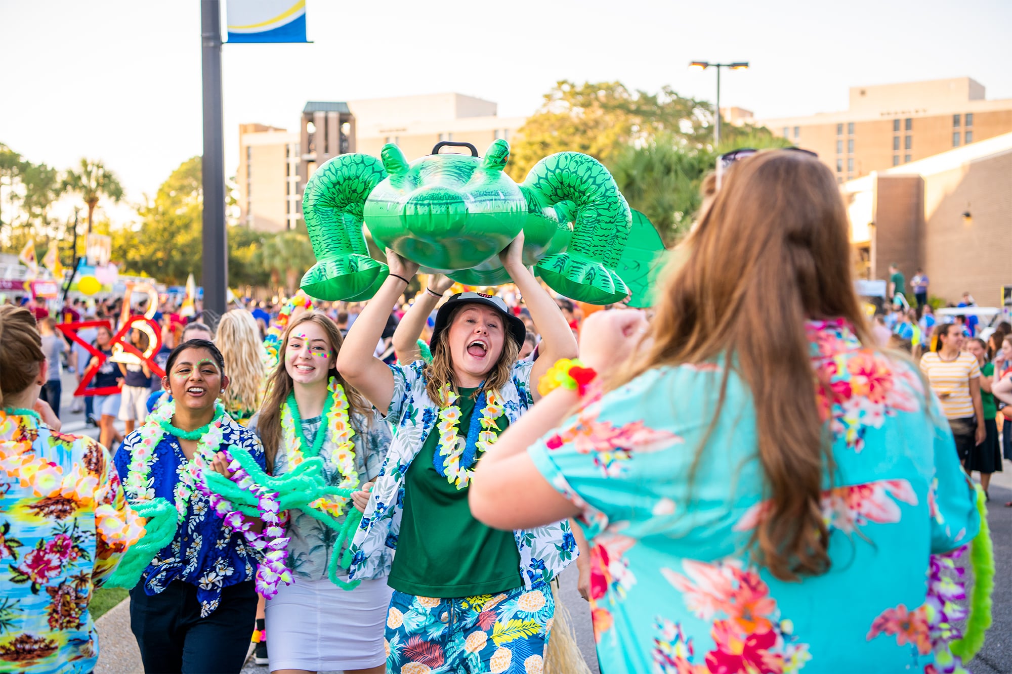 Several members of the Gator collegian carry around a large inflatable gator