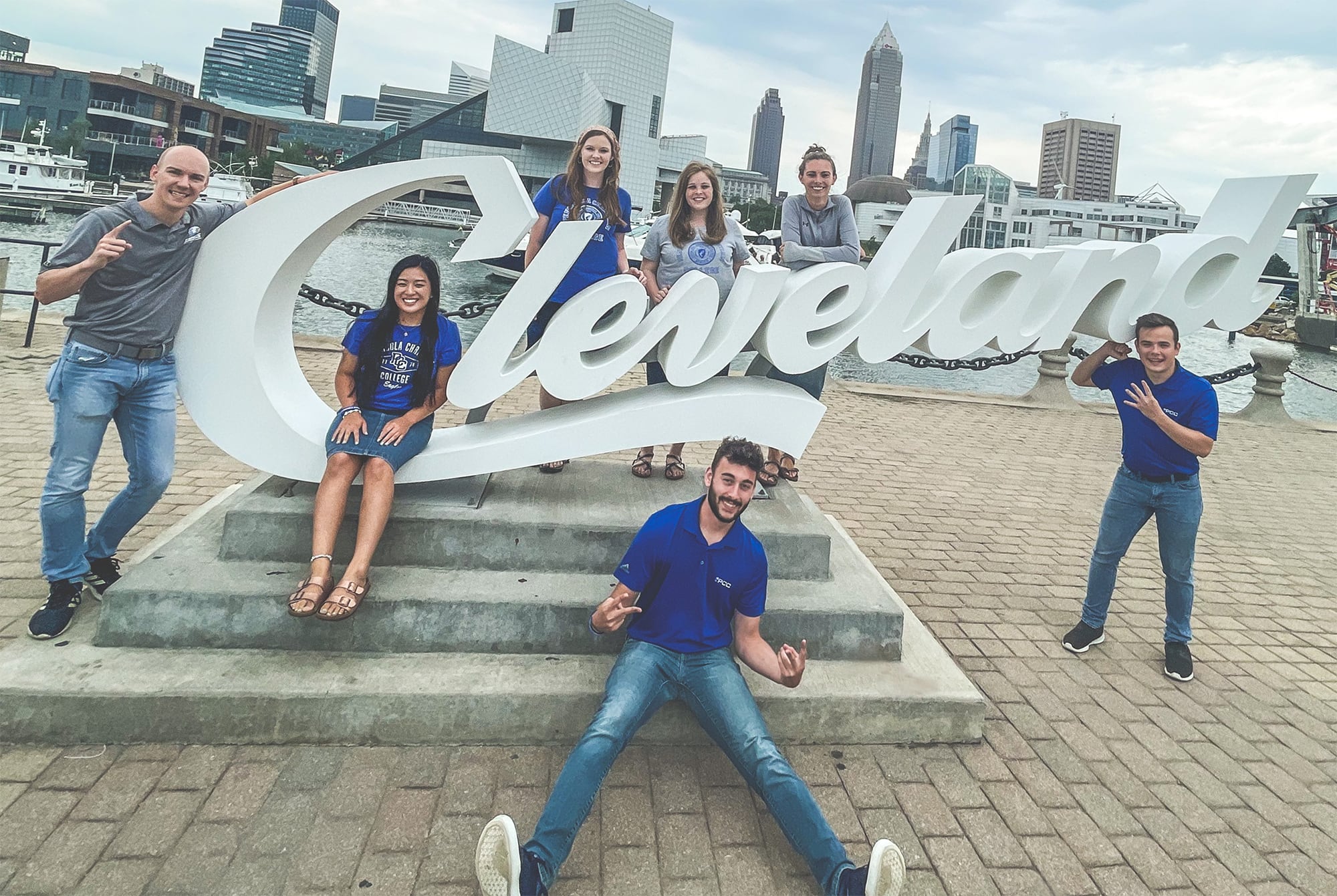 Mark Brown Proclaim team posing with Cleveland sign.