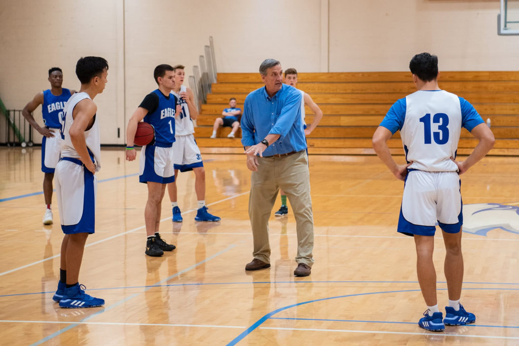 Mark Goetsch coaching the PCC Eagle's basketball team during basketball practice.