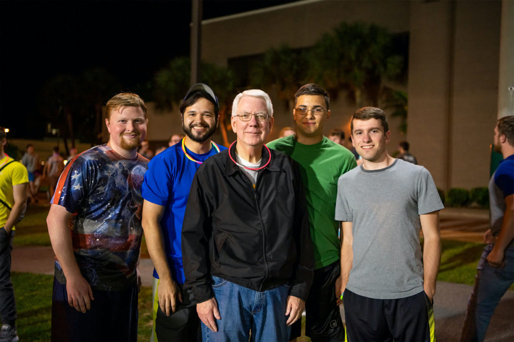A group of guys pose with Dr. Adkins
