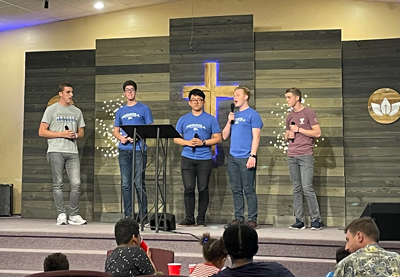 Proclaim team singing at a church