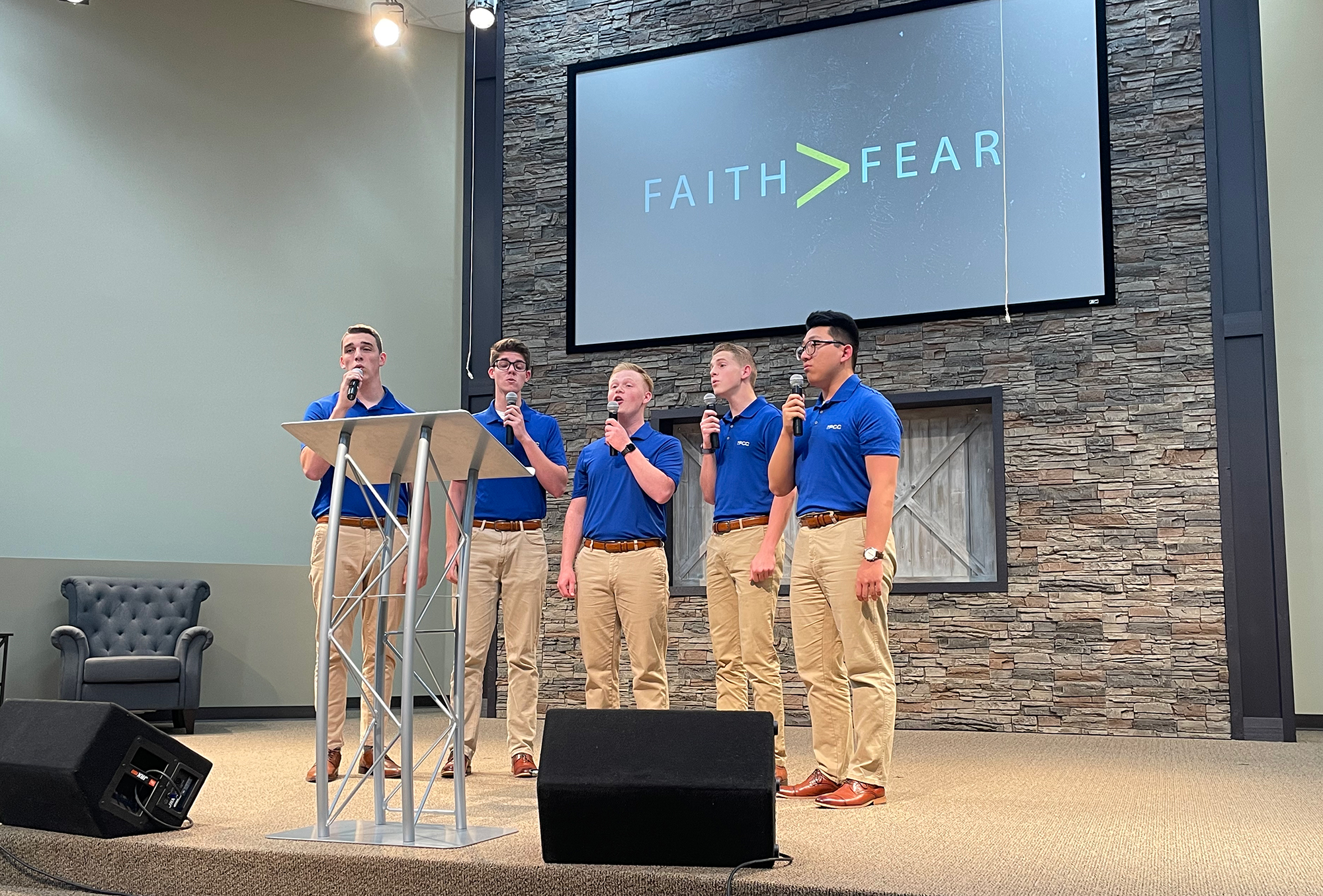 Proclaim team singing at a church event