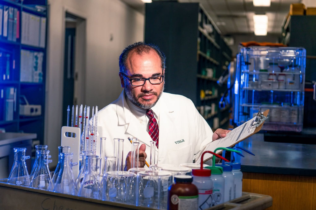 Dr. Sean Vinaja working in a lab. 