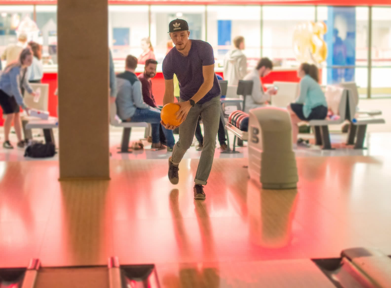 Male student bowling in the Sports Center.