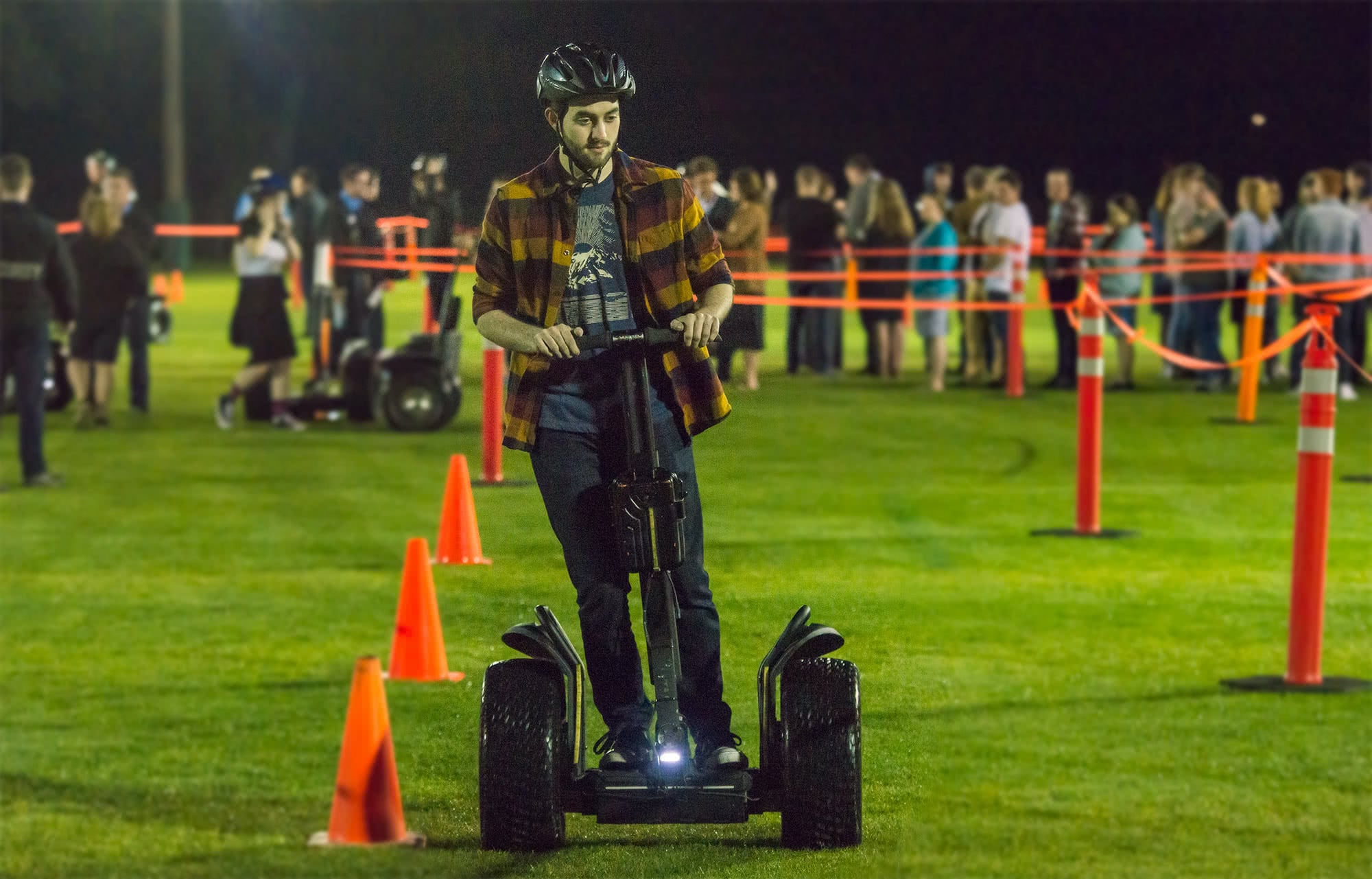 Male student riding a segway.