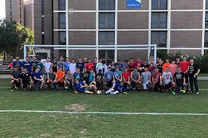 Soccer campers taking a group photo on Eagle's Field.