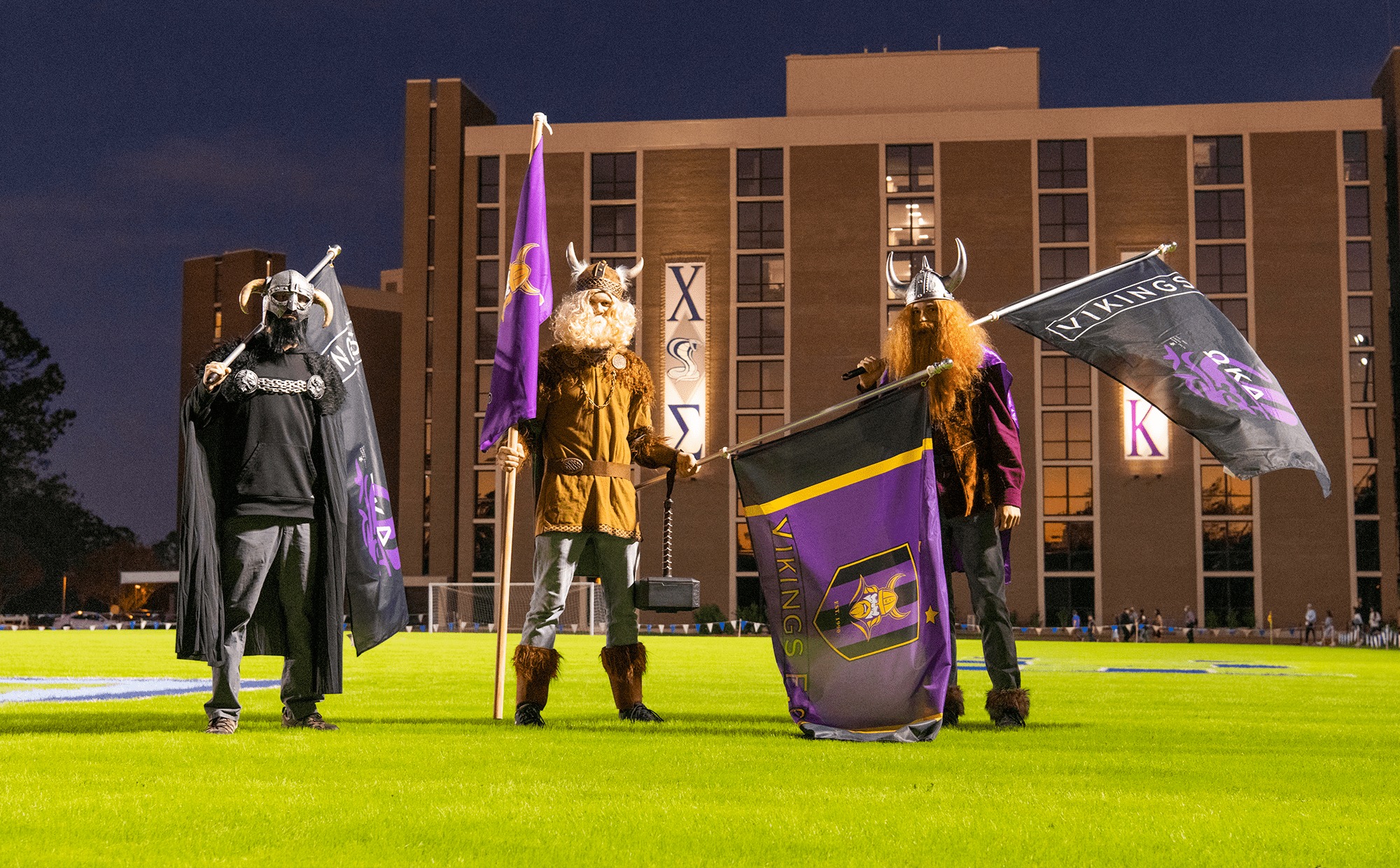 Vikings collegian mascots standing on Eagle's Field.