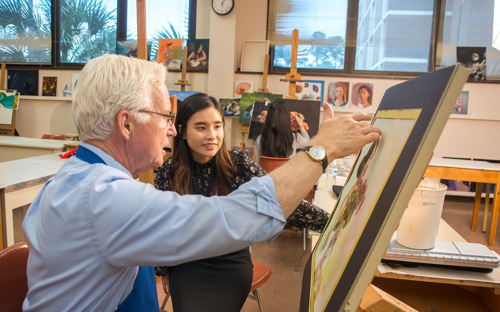 Dr. Jekel teaches a student about lighting in a painting class
