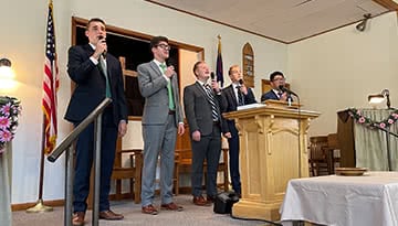Proclaim team singing in a church service.