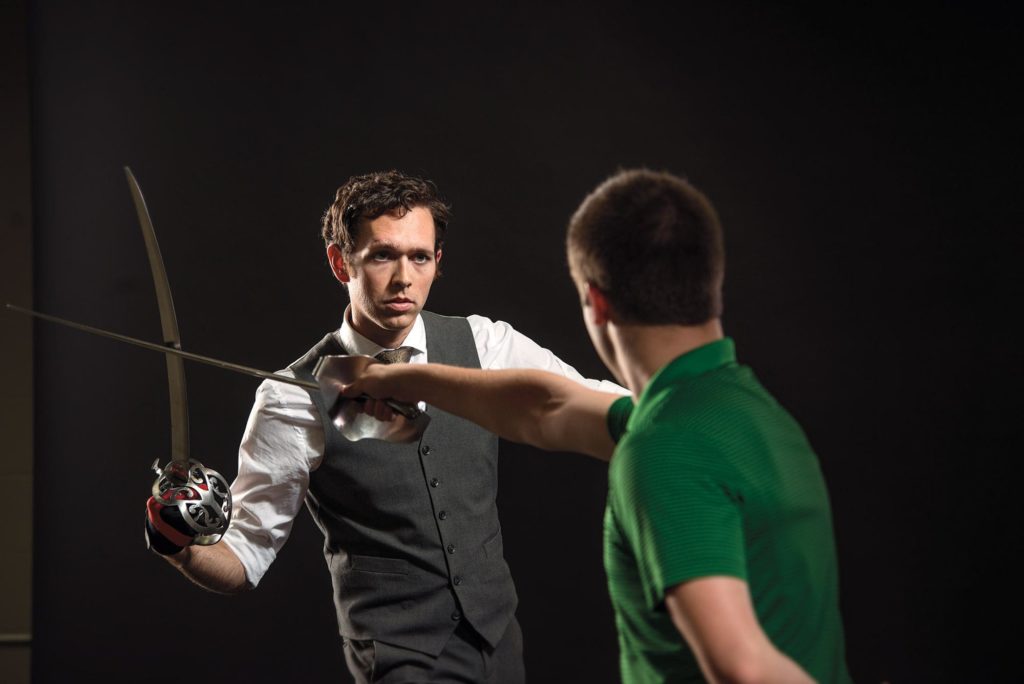 Daniel Webb practicing sword fighting choreography with student, Josh Hutt, who plays the lead. 