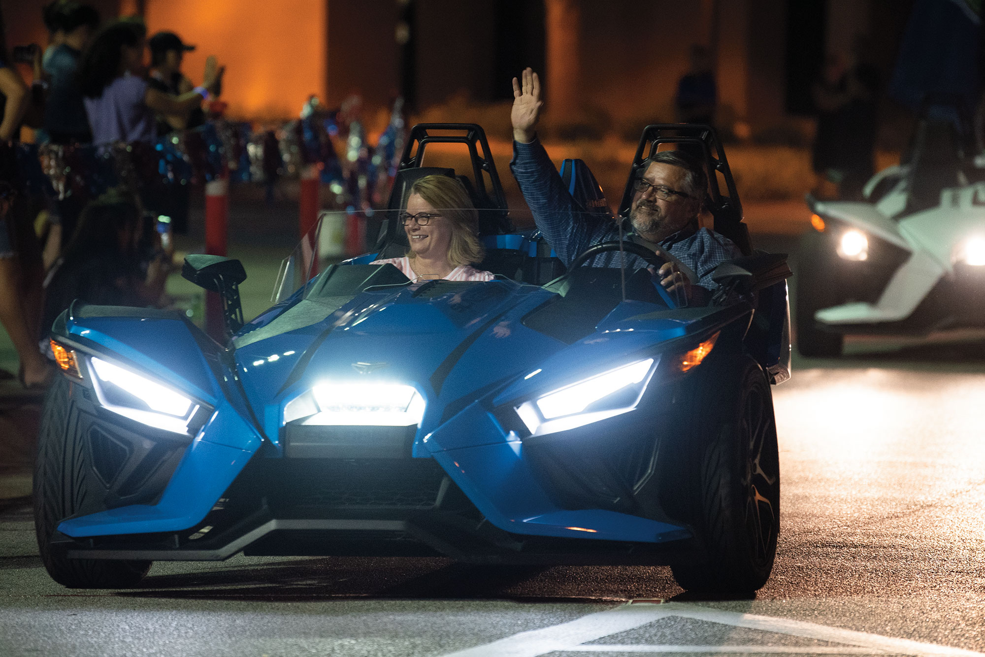 Dr. and Mrs. Shoemaker in a car in the 2021 Greek Rush Parade.
