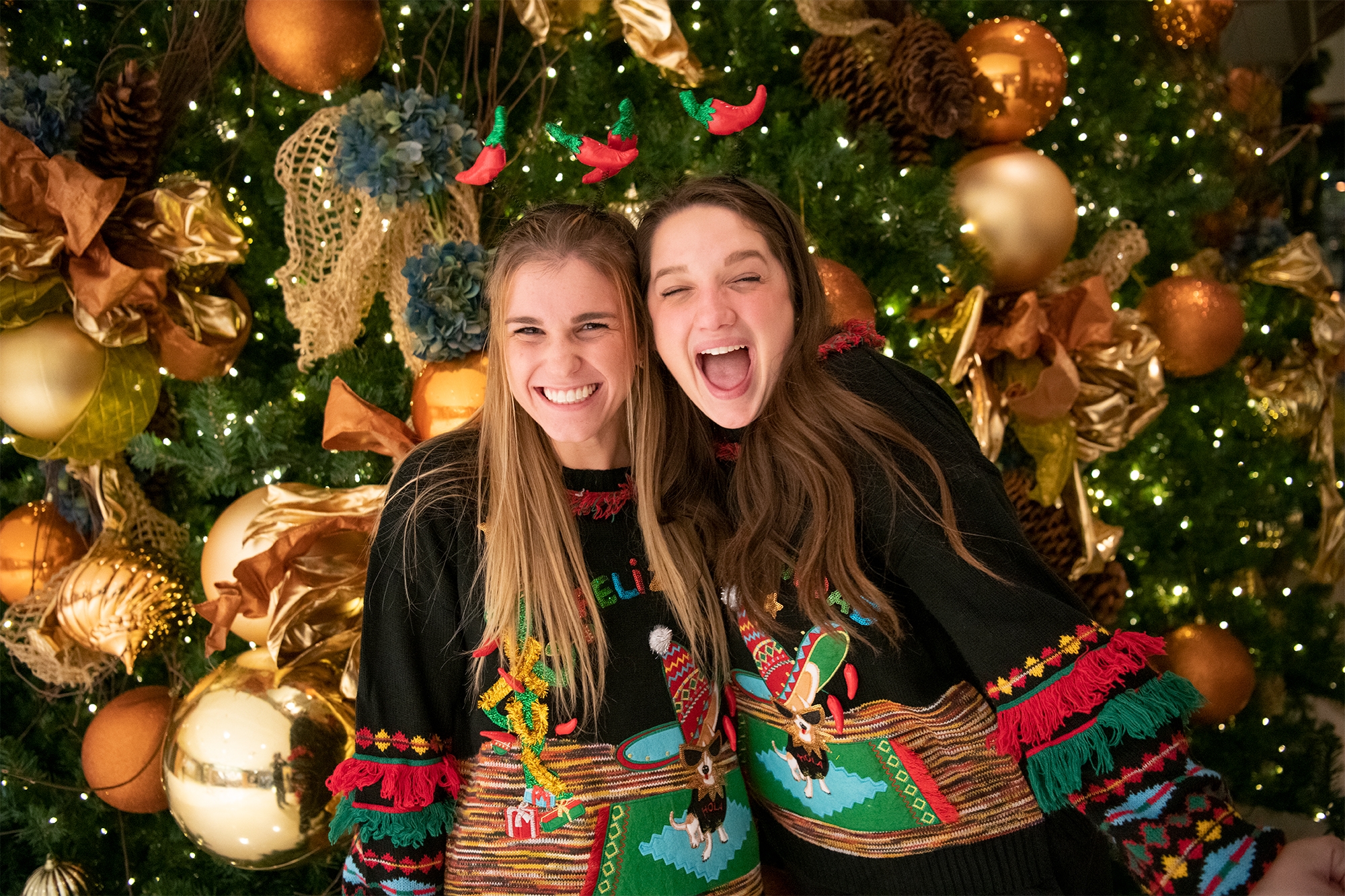 Girls enjoy christmas decorations in the Commons.