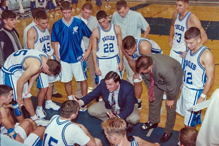 Coach Goetsch in a huddle with the team in 1994.