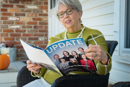 Woman holding The Update Magazine