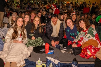 PCC Students wait on their blankets for the Christmas Lights Celebration.